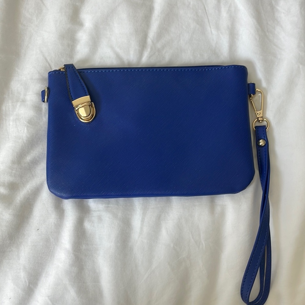 Brand New never used cobalt blue with yellow gold hardware  clutch